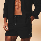 Shorts de baño lisos de secado rápido en negro