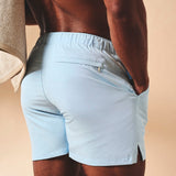 Shorts de baño lisos de secado rápido en azul claro