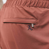 Shorts de baño de secado rápido con ribete en terracota y azul marino