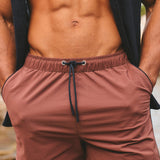 Shorts de baño de secado rápido con ribete en terracota y azul marino