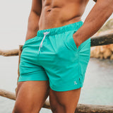 Shorts de baño lisos de secado rápido en Aqua